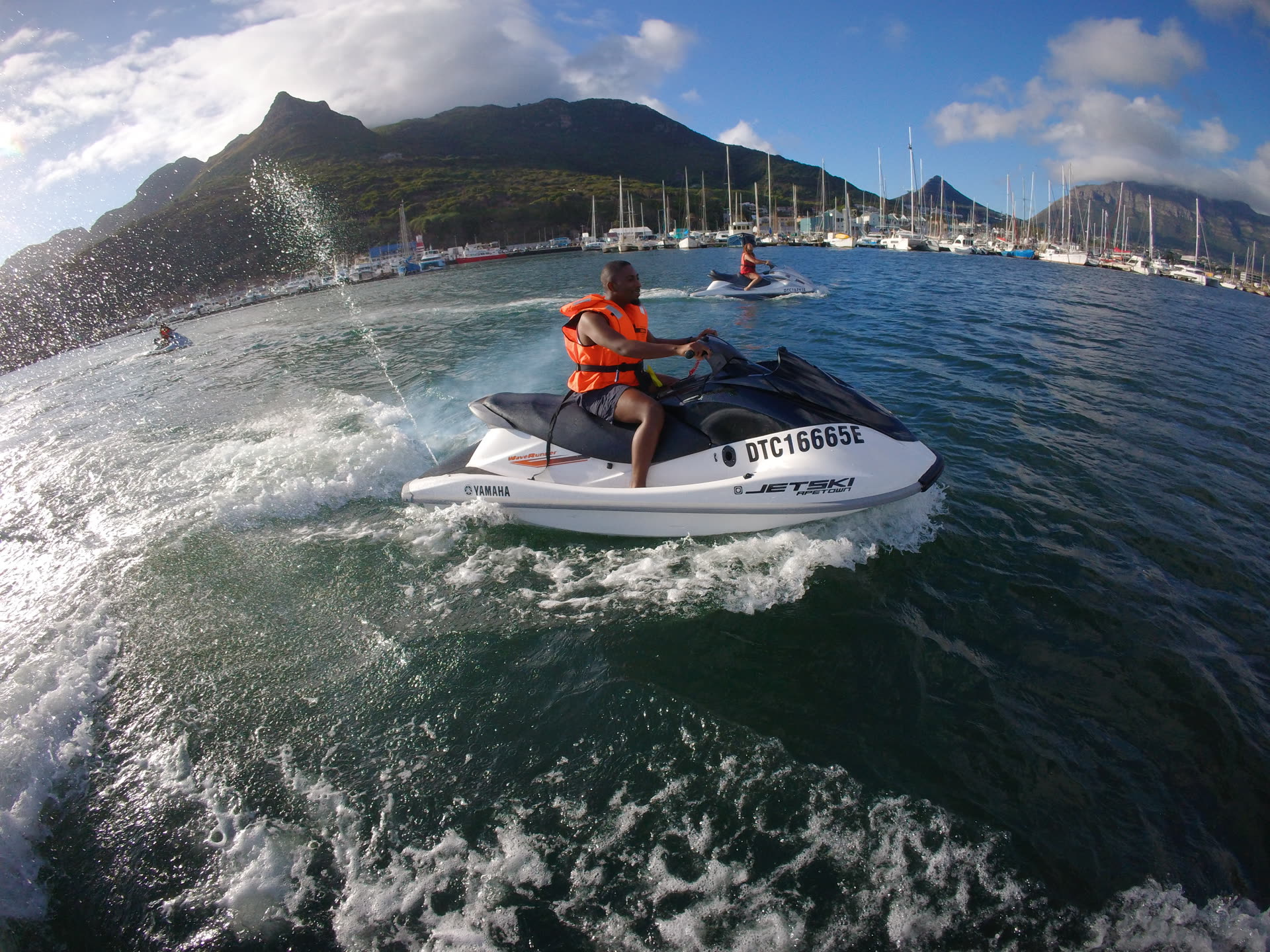 Friends on jet skis on the Atlantic Ocean, Cape Town