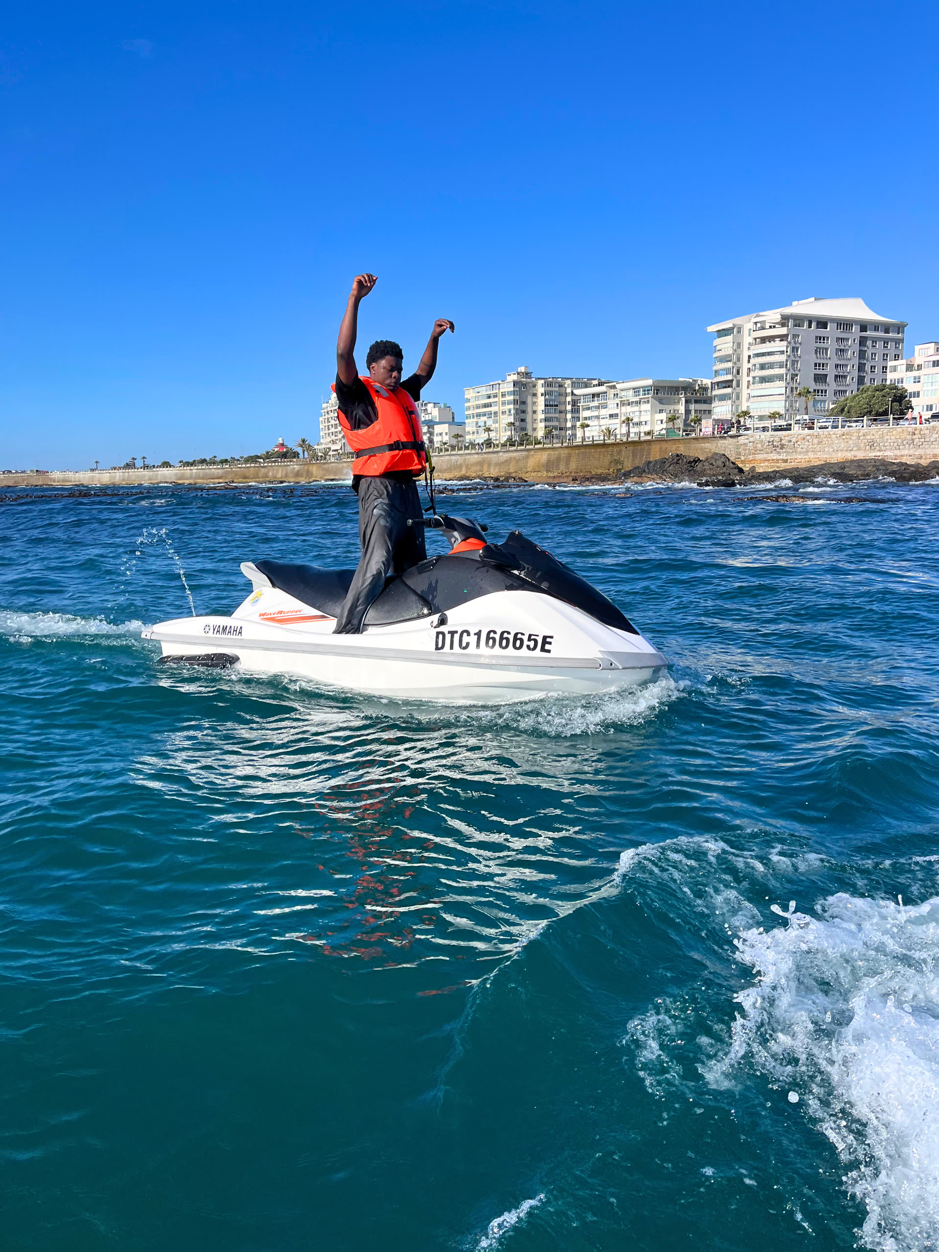 Rider posing on a Yamaha WaveRunner in Hout Bay Harbour, Cape Town